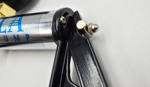 Close-up of the L.A. Pump Chrome Vacuum Pump showing the cap nut that securely retains the piston assembly for a clean, durable design.