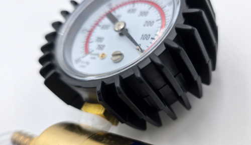 Close-up of premium rubber gauge protection cover installed on vacuum pump gauge